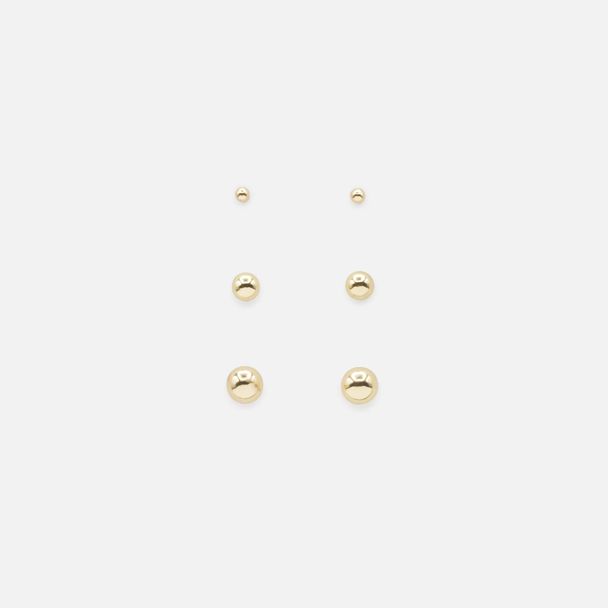 Trio de boucles d'oreilles dorées billes trois formats